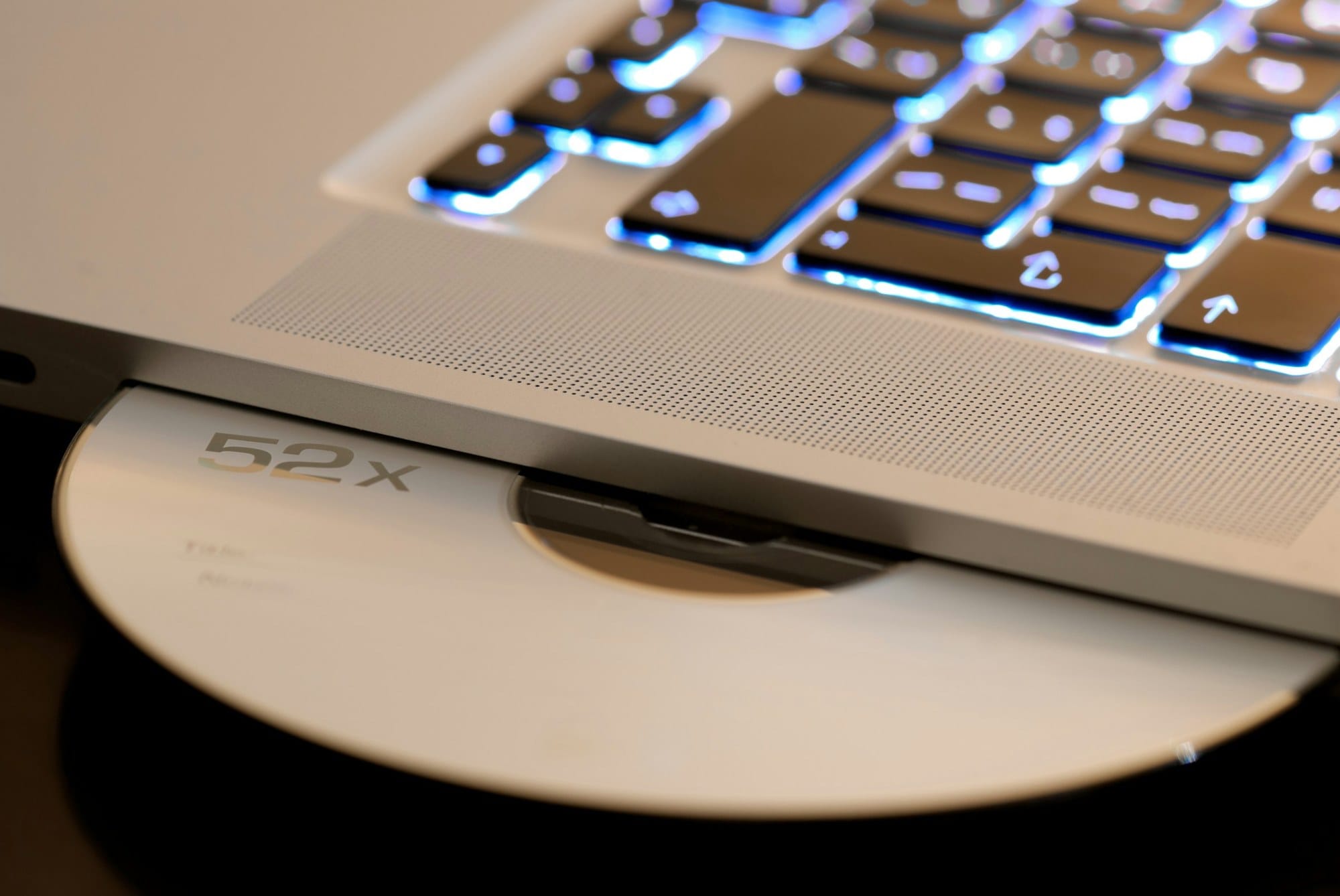 DVD drive and laptop on a desk