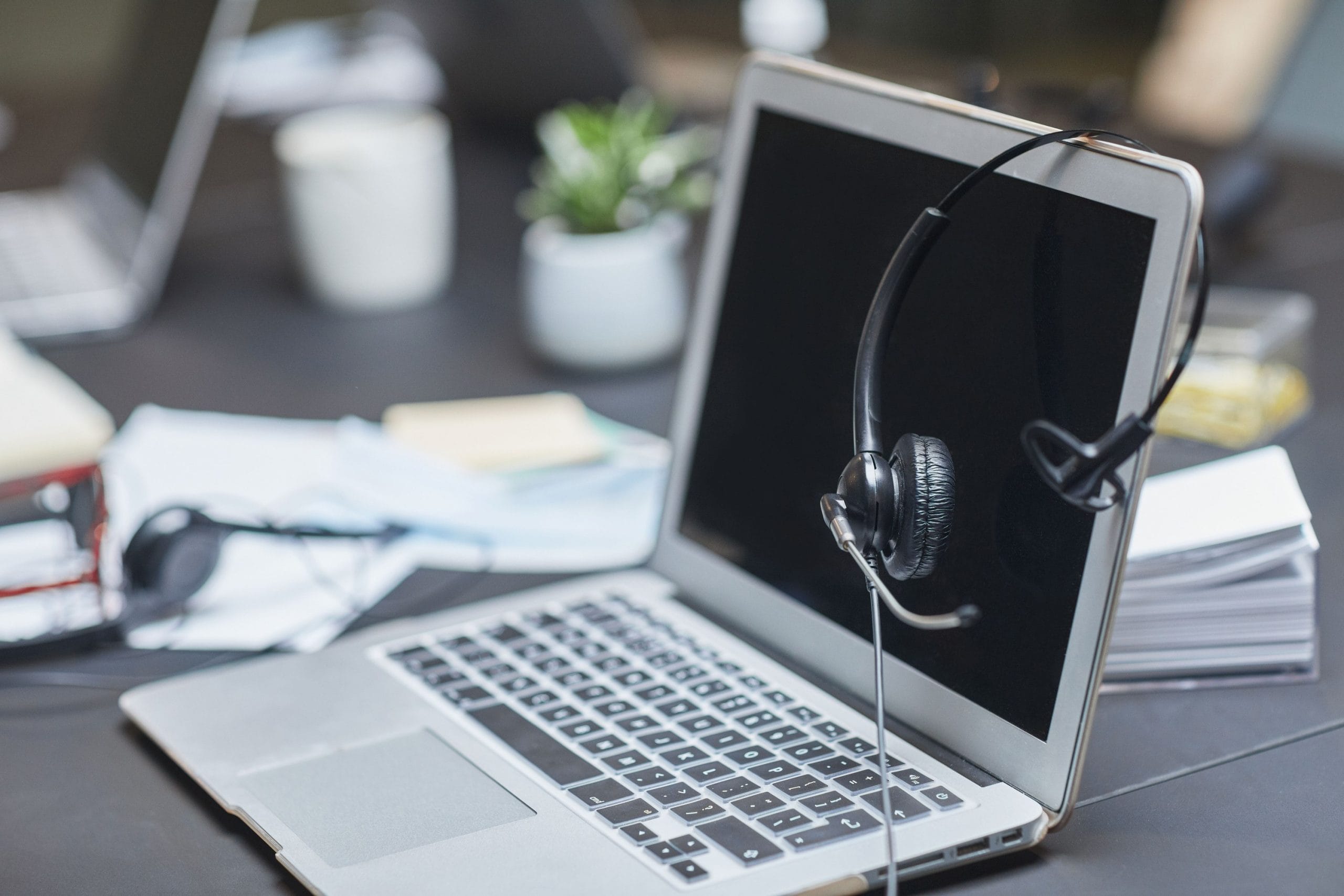 headset and laptop workspace for voice recording